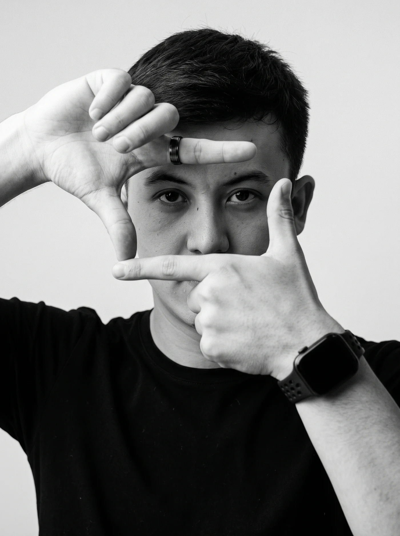 Javohir Tirkashov framing a shot with his hands